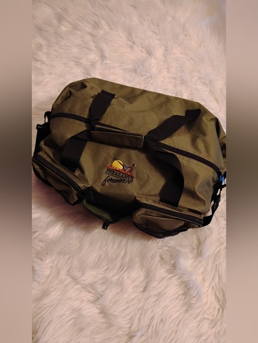 Pheasant Forever olive green outdoor gear duffel bag.